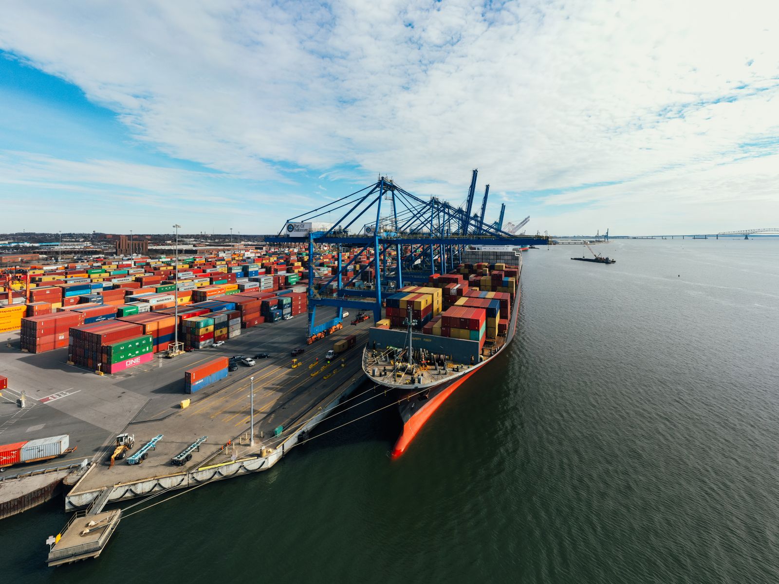 Container ship and cargo cranes at a shipping port